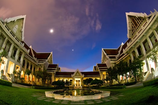 Dhevalai, Thai Temple in dusk,Thailand with Fish Eye Perspective