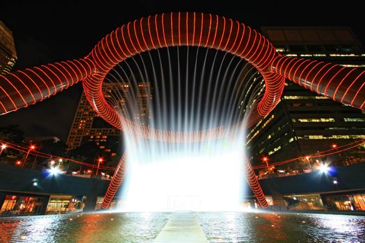Fountain of Wealth in dusk , landmark of Singapore night
