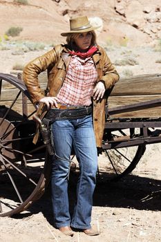 Portrait of blond cowgirl. Western movie style 