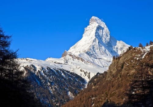 Matterhorn peak over blue sky, Alps in Switzerland