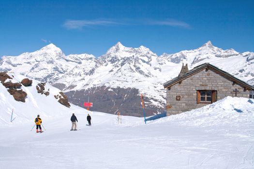 Skier at Matterhorn Alpine alps peak located at Gornergrat in Switzerland