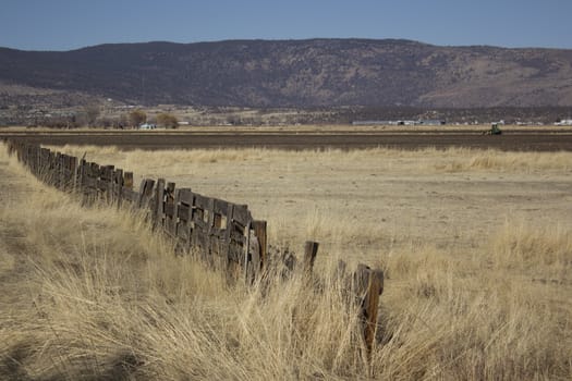 an old wooden fence in a western ranch.
