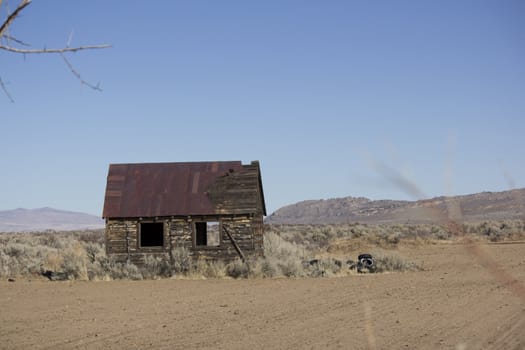 an old rusty shack in the desert.