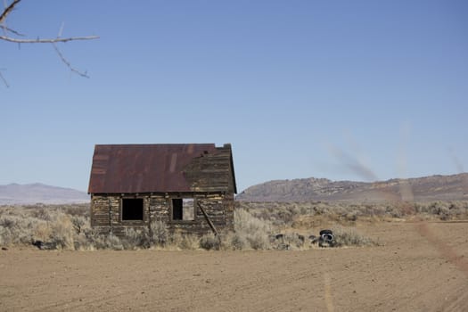 an old rusty shack in the desert.