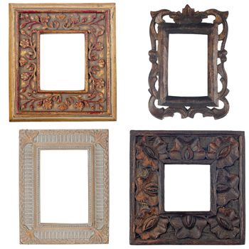 Four antique picture frames isolated on white background.