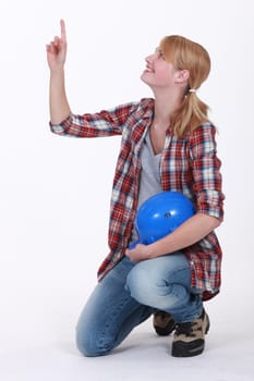 craftswoman pointing and looking up