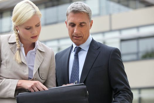 businessman and his assistant working on project