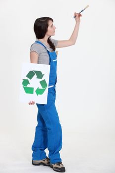 Painter with a recycle sign