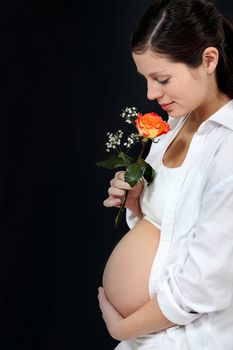 Pregnant woman with a rose