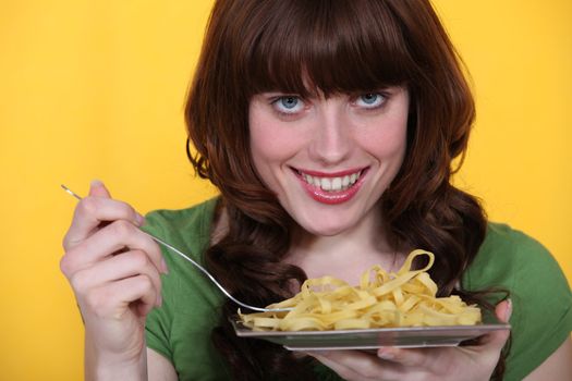 Woman eating tagliatelle