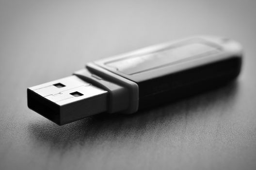 Close up of a pendrive on wood with soft focus