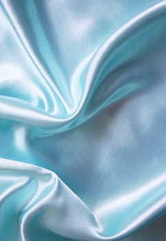 Smooth elegant blue silk as background 