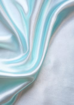 Smooth elegant blue silk as background 
