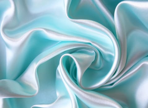 Smooth elegant blue silk as background 