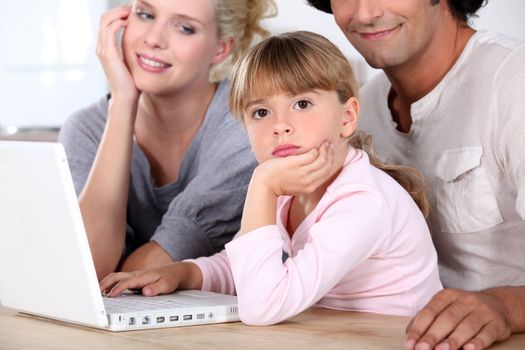 Family in front of laptop