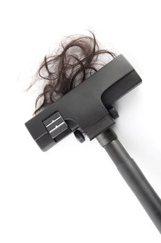 Vacuum cleaning fall hair on white background