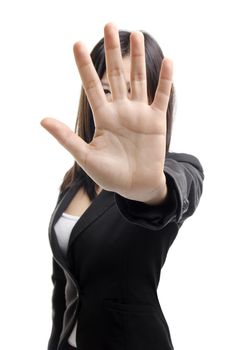 Serious business woman making stop sign over white background. Focus on hand