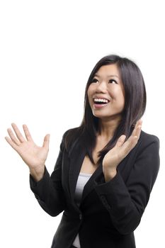 Happy Asian woman looking up and arms out, isolated on white.