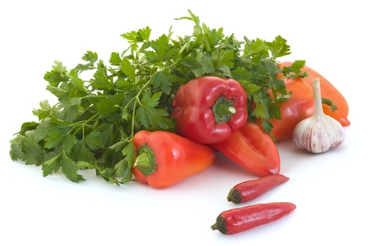Red pepper, parsley and garlic on a white background