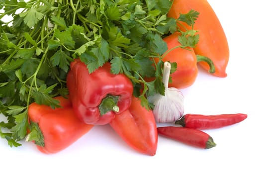 Red pepper, parsley and garlic on a white background