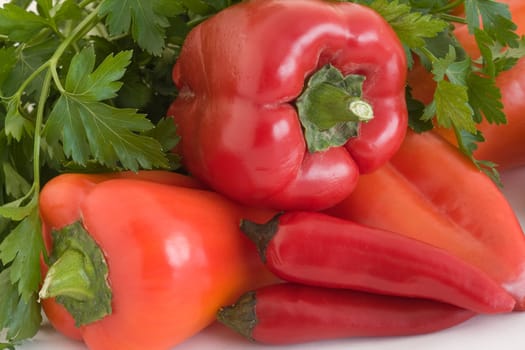 Red pepper, and parsley  on a white background