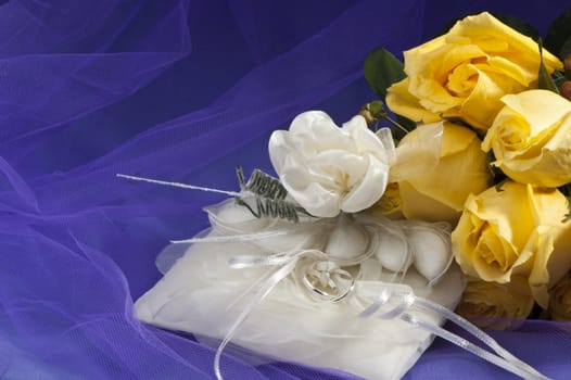 wedding ring ,wedding favors and yellow roses