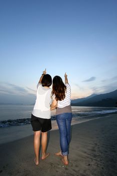 Woman pointing to the sky