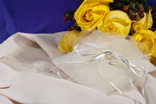 wedding ring ,wedding dress and yellow roses