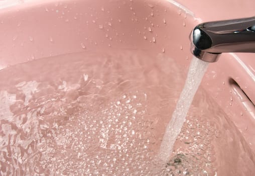 Stream of water running from a faucet

