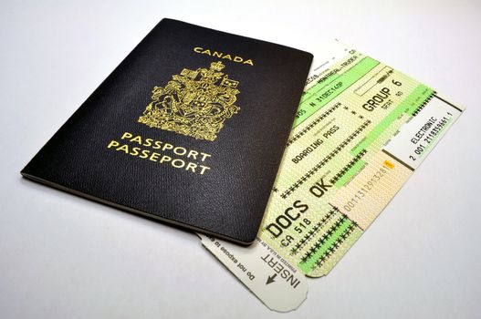 Canadian passport and air travel boarding pass