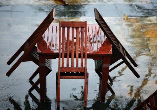 Table and chairs wet from a rain