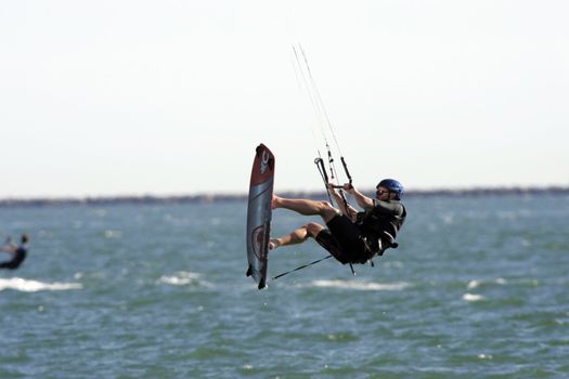 Kitesurfer jumps in the air