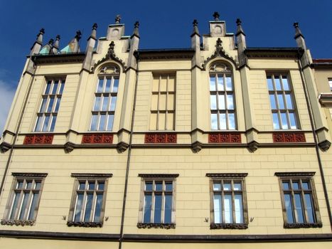 Wroclaw, city center, Market Square with building in classic style, with big windows and roof's decorations.