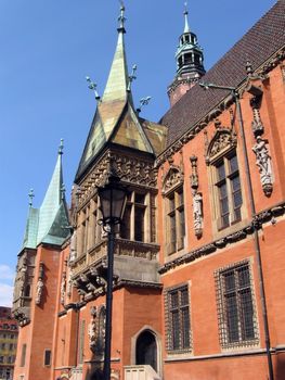 Poland, famous city Wroclaw with beautiful Town Hall building in traditional style with decorated windows.
