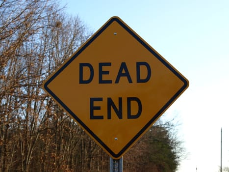 A dead end road sign shown up close