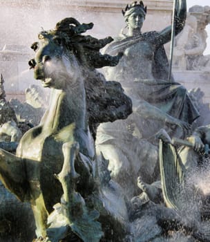 a closeup shot of a fountain in the city of Bordeaux , France.