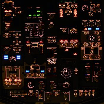 Overhead control panel of a modern airliner at night (Boeing 737-800 Next Generation).