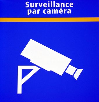 Surveillance camera sign at train station