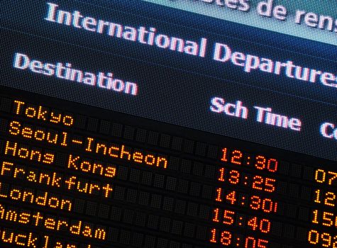 Canadian airport information board, international departures.