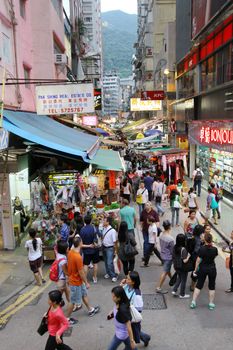 HONG KONG - OCT 9, An old street with many people walking to buy things in Wai Chai, Hong Kong on 9 October, 2010.