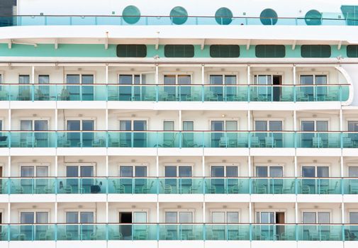 Closeup of cabin balconies of an ocean liner or cruise ship.