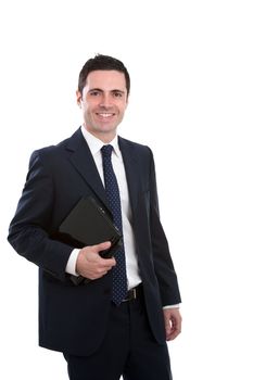 Handsome young business man in blue suit holding laptop. Isolated on white.