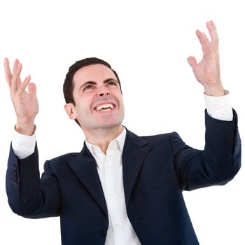 Handsome young business man in blue suit expressing a cry for victory. Isolated on white.