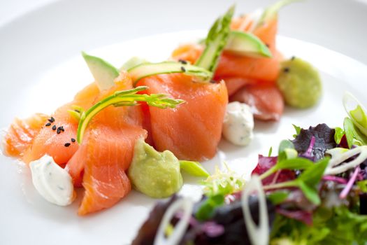 Close up of smoked salmon salad with green asparagus