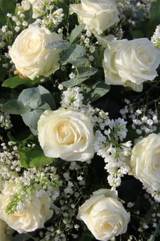 Flower arrangement with white roses and syringa