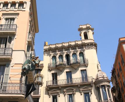 dragon and umbrella in Ramblas street, Barcelona, Spain