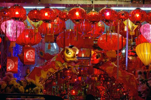 Storefront Displays of Chinese New Year Lanterns and Lion Dance along Street in Chinatown