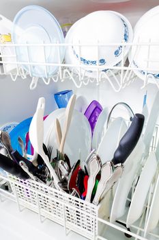 3/4 angle view of clean dishes in the dishwasher.