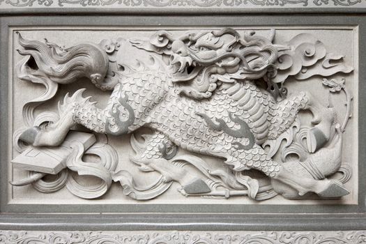 Stone Carving of Qilin on Chinese Temple Wall in Chinatown