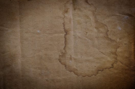 old brown paper texture with stain and burnt edges